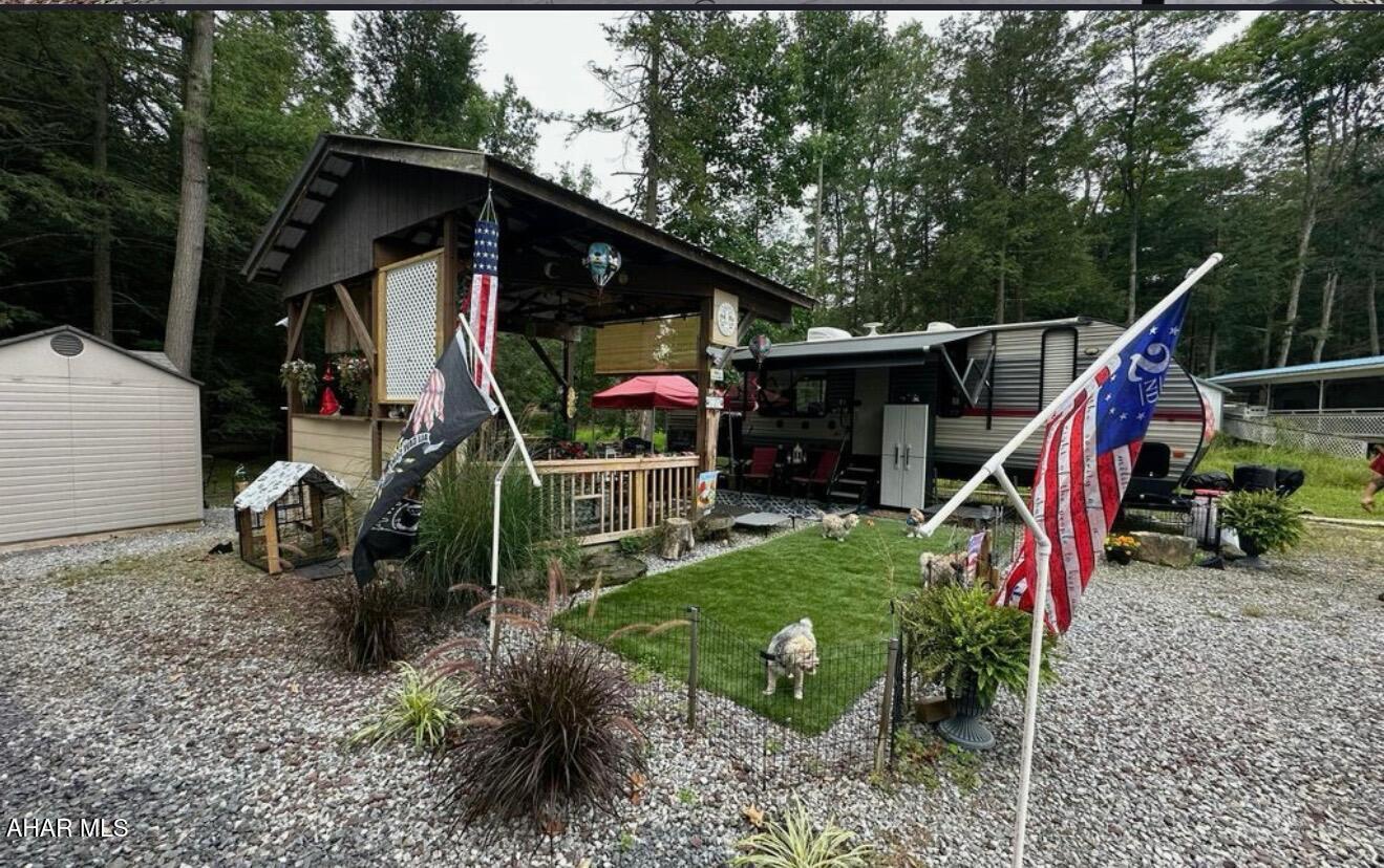 2019 Cherokee camper on 1 lot inside Glendale Yearound. Camper is like new!!! Deck and pavilion right beside camper. Stream flows thru back of property. Fire pit located across stream. Great location at back of circle. Seller may consider removing camper and just selling lot with a reasonable offer. Glendale Yearound is a gated community located minutes from Prince Gallitzin State Park and Glendale Lake. Community pool, tennis, basketball, and more.