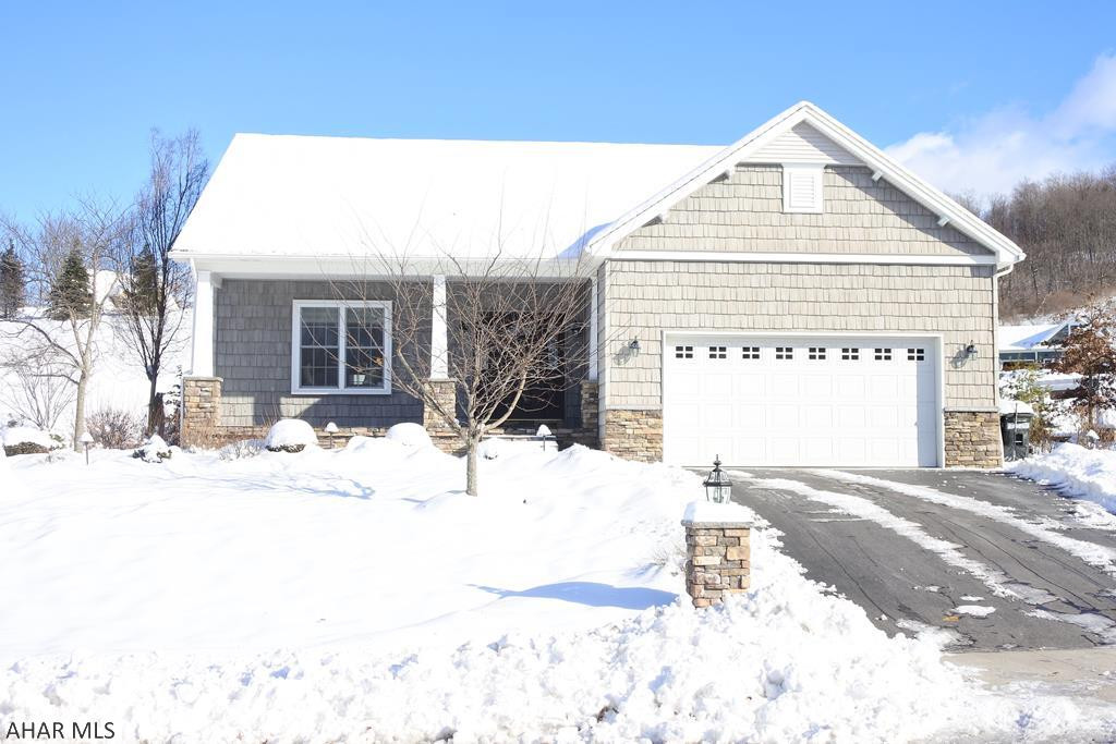 Newer home in Pleasant View Estates.  Open concept, with recessed lights, stone columns and built-ins.  Huge granite island with breakfast bar, lots of kitchen storage, dining area and doors to a covered, stamped concrete patio.  Living is easy with the spacious owners' suite, walk-in closet, master bath and laundry ALL on the first floor.  2nd floor is a perfect kids' retreat with 2 additional bedrooms, a full bath and bonus room.  The lower level almost doubles your living space....a family room, play area, 3/4 bath and queen sized, built-in bunk beds ( 4th BR?, genius design).  Craftsman Style Exterior...covered porch, stamped concrete.  There is a heated 2 car garage.  Landscaping done by Tussey Mountain.  Quality inside and out!