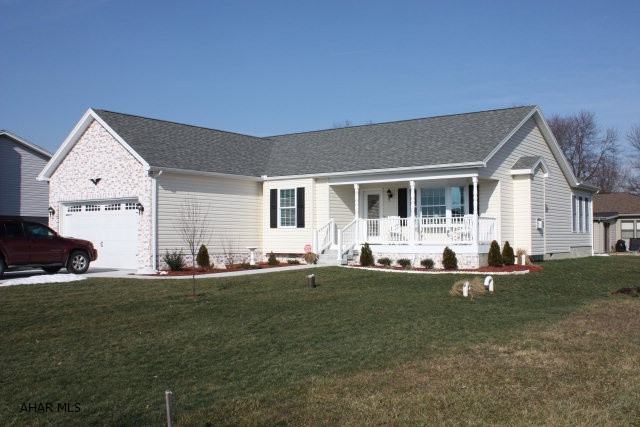 1 year old Custom home built by Dempsie.  Single floor living with a beautiful sunroom and a amenities throughout.  Hardwood floors and open floor plan with vaulted ceilings.  Walk in master closet, gas fireplace and all the kinks worked out of new construction.  Sit on the front porch or on the back patio and relax.  This house is showroom condition and ready for you to move right in.