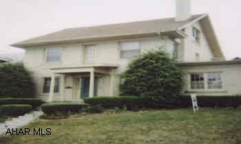 LOADS OF CHARACTER.  3 STORY BRICK GEORGIAN COLONIAL WITH NATURAL WOOD WORK THROUGHOUT, GRACIOUS LIVING ROOM WITH STONE FIREPLACE, CHARMING FAMILY ROOM WITH TERRA-COTTA FLOOR AND BRICK FIREPLACE.  BATHS HAVE BEEN REMODELED.  STUNNING STONE PATIO.  2 CAR GARAGE.