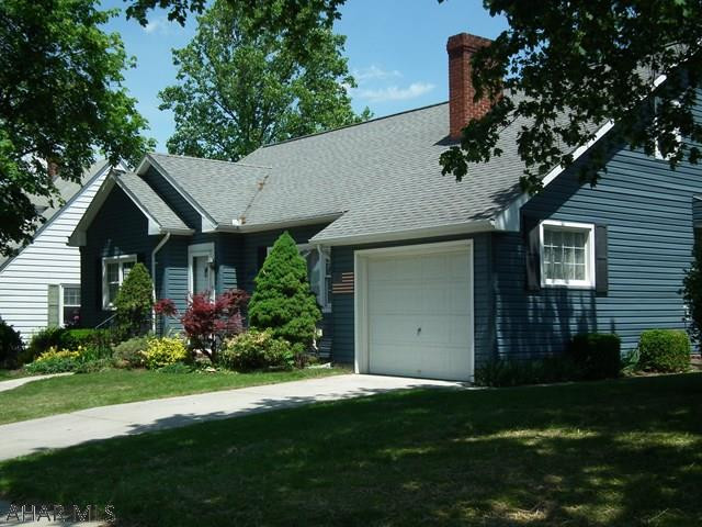 Cape Cod in great location! This 4 Bedroom 2 1/2 Bath home has hardwood floors throughout (carpeting has H/W underneath), Lg. Living Room with built-ins and fireplace, Dining Room has sliding glass doors to covered patio and pretty back yard. Full basement finished, attached garage. Close to school and walking!