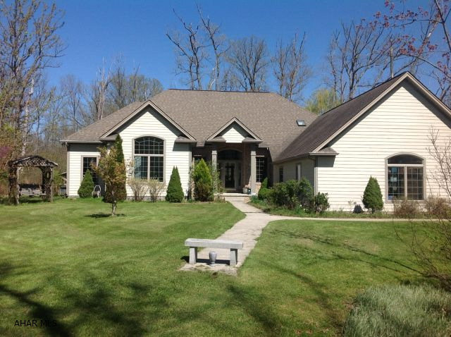 Beautiful and Peaceful. One Story home located on 4.63 Private acres.This Open Concept home offers a huge Living Room  with Vaulted Ceiling, Gas Fireplace and large windows looking out to the Private Screened in Patio. Beautiful large kitchen with Granite Counters, Center Island with Cook Top. Bright and Roomy Breakfast Nook, Large Walk In Pantry. Laundry is located right off the Kitchen, also the Dining Room, Office/Den and Entrance Foyer are all part of the Main Area. Large Master Bedroom with Beautiful Master Bath and Walk In Closet. Many more amenities...come see!!