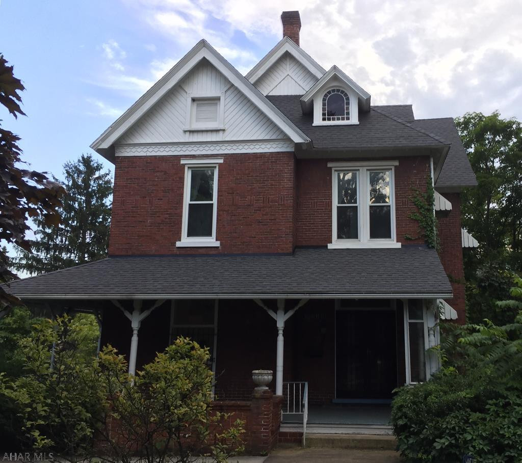 Charming Victorian home in Allegheny Street. NEW ROOF!!! NEW PLUMBING!!! Fresh paint! Spacious rooms. Living room has built-in bookshelves. Dining room has beautiful tile fireplace. Lovely pocket doors create privacy for dining and living areas. Some of the ceiling fixtures are original to the house. Wrap-around porch and 2 private porches at rear. Patio for picnicking, with spacious yard. Garage/carport area includes space for 3 cars, large storage shed, and 2 room office. Priced to move!!!