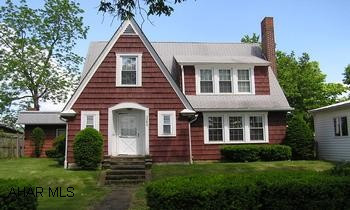 Quaint cedar shingle cottage and guest house on beautiful landscaped lot with mountain views. Large kitchen with oak cabinets galore. Stone fireplace in living room, 1st and 2nd floor bedrooms and baths, cheerful sun room, privacy fence, storage shed, pavillion, hardwood floors, skylights.