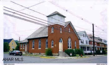 Nice 2 story brick Brick with 3 rooms & foyer on 1st fl. and 7 rooms and 2 baths in basement, on a 85x125 lot in nice location.  New oil hot water baseboard heat, beautiful oak pews with padded seats, organ, desks, 2 alters, and copy machine included. Nice 2 story brick church with a foyer, and 3 rooms on the first floor, and 7 rooms and two restroom in the basement.  In a great residential area on a 85x125 lot.  Many possibilities to use as a church, home or apartment, etc., newer oilhot water baseboard heat, 60 amp electric service, beautiful oak pews with padded seats, organ, desks, 2 alters, and copy machine all included.