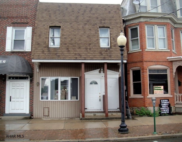 Well kept former doctor's office with 2nd floor apartment. 1st floor w/ waiting room, reception area, 3 office rooms, 3 half baths, lg conference room w/ library & storage. 1st floor could be converted into 2 apartments. First floor has central air. Second floor is a beautiful apartment w/ 3 BR, full BA, kitchen, LR, DR and utility room including laundry hook up. Second floor could also be office space. Private front & rear entrances for both floors. New electrical, new wiring, rubber roof w/ 40 yr warranty. Off street parking. Oil HW heat, city water and sewer. Nice! Make an offer - all offers will be given consideration! Seller will finance $24,900 over a 5 yr period w/ $50,000 paid at closing for a total of $74,900. Once per year from the closing date, $4980/yr is due for 5 years.