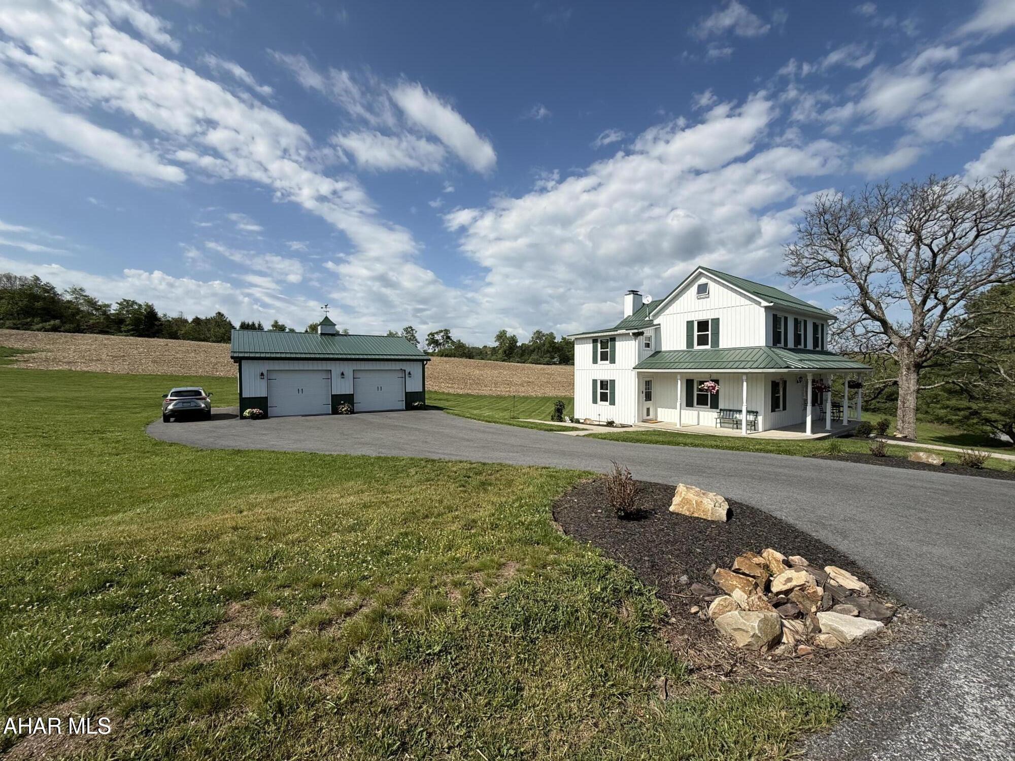 Escape to your own private oasis with this beautifully restored country estate nestled on 12 +/- scenic acres in the heart of Bedford County. Thoughtfully transformed from the ground up, this exceptional property blends timeless character with luxury modern upgrades, breathtaking countryside views, and the kind of peace that is becoming increasingly rare to find.

Wake up each morning to rolling country views, the peaceful sound of birds chirping, and sheep grazing nearby, a setting so serene it is difficult to fully capture in words. From the moment you arrive, the property offers a sense of calm and privacy that makes everyday life feel worlds away from the stress of everyday living. Whether enjoying coffee on the wraparound porch, watching the sun rise over the countryside, or relaxing in the quiet evenings surrounded by nature, this property was designed for those seeking peace, beauty, and space to truly unwind.

Beautifully landscaped and surrounded by scenic mountain and countryside views, the setting feels like your own private retreat while still offering the comfort and convenience of a fully renovated home in turnkey condition. Conveniently located with easy access to the Pennsylvania Turnpike, Interstate 70, and major travel routes, the property allows convenient access to Washington DC, Virginia, and Maryland while still enjoying the tranquility of country living.

Bedford County is known for its historic charm, scenic countryside, beautiful covered bridges, mountain views, and peaceful backroads that make this area one of Pennsylvania's hidden gems. Rich in history and natural beauty, the county offers a lifestyle filled with small town charm, outdoor recreation, and breathtaking scenery year round.

12 beautiful scenic acres
Oversized insulated garage with utilities
Extensively renovated
Luxury kitchen and baths
Professional landscaping and hardscaping
Wraparound porch with stunning countryside views
Peaceful country setting filled with natural beauty
Turnkey condition

A rare opportunity to own a private Bedford County retreat where all the hard work has already been done and the peaceful lifestyle you've been dreaming of is waiting for you.