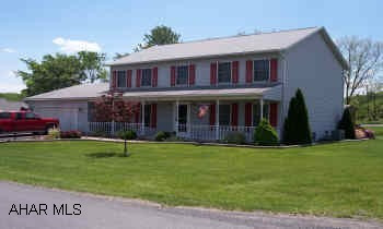Newer two story 5 Bedroom house in Lakewood Manor Development Eat in Kitchen, Front porch and back deck spanning length of house.  Walk in closets, pantry and Stone Fireplace.