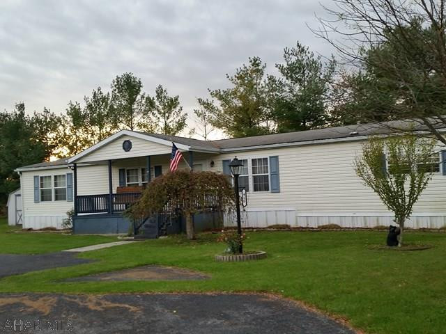 Spacious 72 x 28 Laurel doublewide w/family room w/fireplace, 3 bedrooms, 2 baths, walk-in closets, 2 porches, small fenced yard off back porch, ceramic tile in baths, French Doors to side deck. Lot Rent $381/mo includes trash & road plowing. Stove, refrigerator, dishwasher, wishing well & shed also included in sale. Must be approved by Manager to live at Independence Place, LP. Attached are 3 docs as received from Independence Place Manager on 11/27/17: The application, letter of instructions and copy of the rules & regulations.  J-409