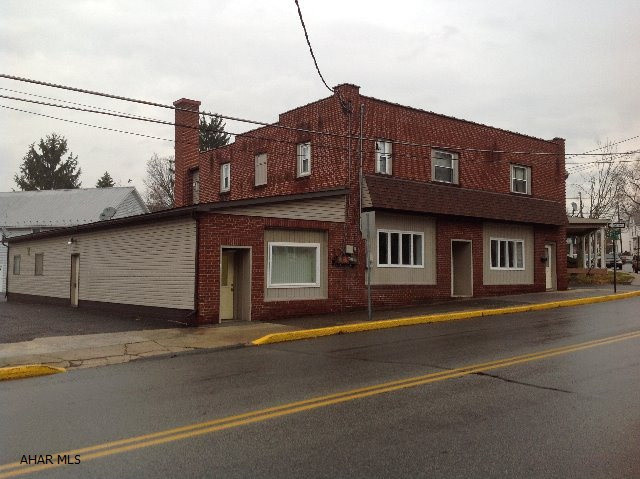 Great Investment Property in Downtown Bedford! Well maintained building and freshly painted inside. Ample parking up to 10 off street spaces provided. 3 separate entrances into the main building with sidewalks and easy travel flow of RT 30. First level offers renting up to 3 tenants or just 1 tenant with there own entrance. Space provides approx. 2575 sqft. Building offers 2-100 amps, 220 amp, 1 and 3 phase electric, AC and utilities are separated.  Building has been very well maintained. 3 bedroom 1 bath apartment upstairs tenant pays $600 a month with a lease.  Natural gas hook up is available.  RENTAL SPACES AVAILABLE!! 2 front spaces $1200a month and Landlord pays all utilities. If Renter wants all 4 spaces on the Main Floor $1200 a month the tenant pays utilities.