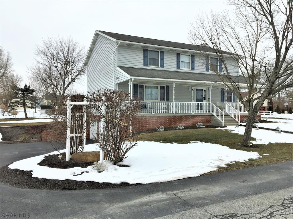 Immaculate vinyl/brick  2 story w/4 bedrooms and 4 baths. Easy care maintenance and landscaping. Relax swinging on the inviting front porch, rear deck, paved drive w/2 car integral garage. Walk in the front door to a tiled foyer, spacious living room, formal dining room, eat- in kitchen with stainless appliances. Cozy family room with wood fireplace. Main level laundry. Upstairs has large master bedroom w/ private bath and walk -in closest. 3 extra spacious bedrooms and full bath. Walk up attic storage. Basement is partially finished with a wood stove, half bath and more storage, plus 2 car garage. Heated with F/A heat pump with central air. Don't miss out on this one!!