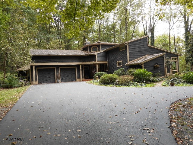 4 BEDROOM 2 BATH 2 STORY HOME IN COUNTRY SETTING ON 11.69 ACRES. NEXT TO IRON MASTER COUNTRY CLUB. YOU CAN EVEN PLAY TENNIS ON YOUR OWN COURT.  CLOSE TO SHOPPING AND SCHOOL AND ONLY 4 MILES FROM I-99 AND THE BLAIR COUNTY AIRPORT.  WATCH THE DEER AND BEAR FROM YOUR BACKYARD.