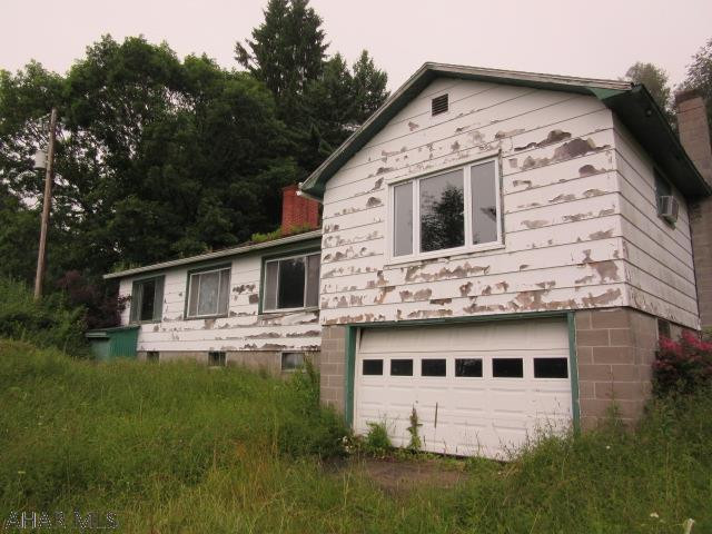 If you are looking for privacy look no further! Over three acres near the Bedford County line, large detached garage
