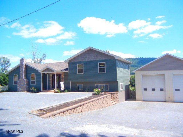 OPEN HOUSE, SUNDAY 3/20 (2:30 -- 4:00) Spectacular and spacious!!  This home offers 4-6 bedrooms (Master bedroom and Master Bath are on main level) with 3 more bedrooms on 2nd level and 2 more BR in lower level. There was an addition in 2011 - which included the Family room and 1/2 bath, Master bedroom and master bath as well as the 2 bedrooms and full bath in the lower level)  COOK'S DREAM kitchen was well thought out (very functional)w/center island - also an appliance shelf that proudly displays your Kitchen Aid mixer yet tucks away when not in use.  Home is spacious throughout. The home is beautifully situated on an acre of ground and has a large portion fenced in.   Also has a detached 40 x 52 garage with 12 foot doors that is heated and has water as well!!  Call agent to view home.