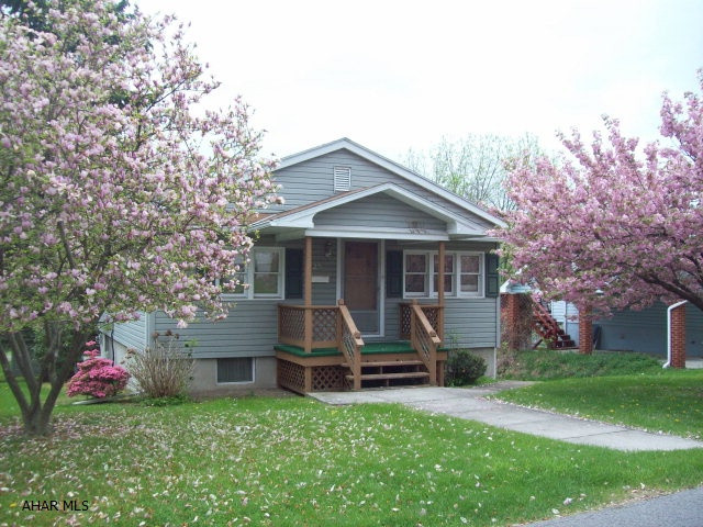 Sweet bungalow with 2BRs and 1BA.  Nice covered rear deck with parking area underneath.  Easy living.  Semi modern kitchen and bath.  Appliances are included.  Central air.