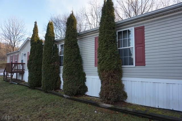 THIS IS A MUST SEE! Spacious and open well maintained 3 bedroom 2 1/2 bath double wide in Camelot Woods, Beautiful kitchen with eat in area, Large formal living room. Nice family room off Kitchen. Spacious master bedroom with master bath and walk in closet.  Attractive setting with off street parking. Call listing agent today for your viewing. Lot rent includes sewer and trash.