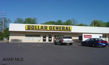 Free standing building of 9400 sq' includes these tenants...Dollar General, Chinese Restaurant, Puff n Snuff tobacco shop. Income information on file at office.