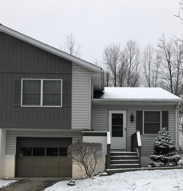 Come see this well maintained 2 bedroom town house in a great neighborhood with a 1 car garage, electric baseboard heat with storage heat and a shed in the backyard. Taxes will be reduced in 2017. Entertain in the finished family room on lower lever or on the deck --and enjoy the fresh air at the top of Timberline.