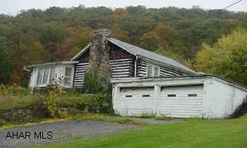 .94 acre,1 story,2 car garage,2 bd,1 bath,log cabin,built in 1940 Don't pass this one up,needs some TLC,almost 1 acre,1 story,2 bedroom,1 bath,log home,2 car attach garage