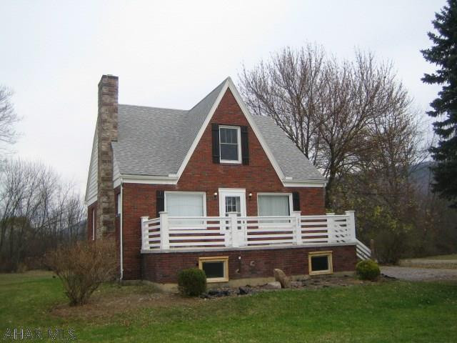 Fabulous brick Hollidaysburg home on one acre & completely remodeled throughout! Convenient 1st floor bedroom and bath. Beautiful, newer kitchen with sun room eating area. Spacious living room with fireplace, newer baths with ceramic tile, beautiful hardwood floors, freshly painted interior and all new wall to wall carpeting. Newer thermo windows & roof. Just move in!