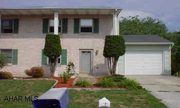 3 bedrooms 1/2 double home, knotty-pine panelled wall in living room, freshly painted, new baseboards, and thermostats. Full brick front with pillars and split rail fence. One owner.