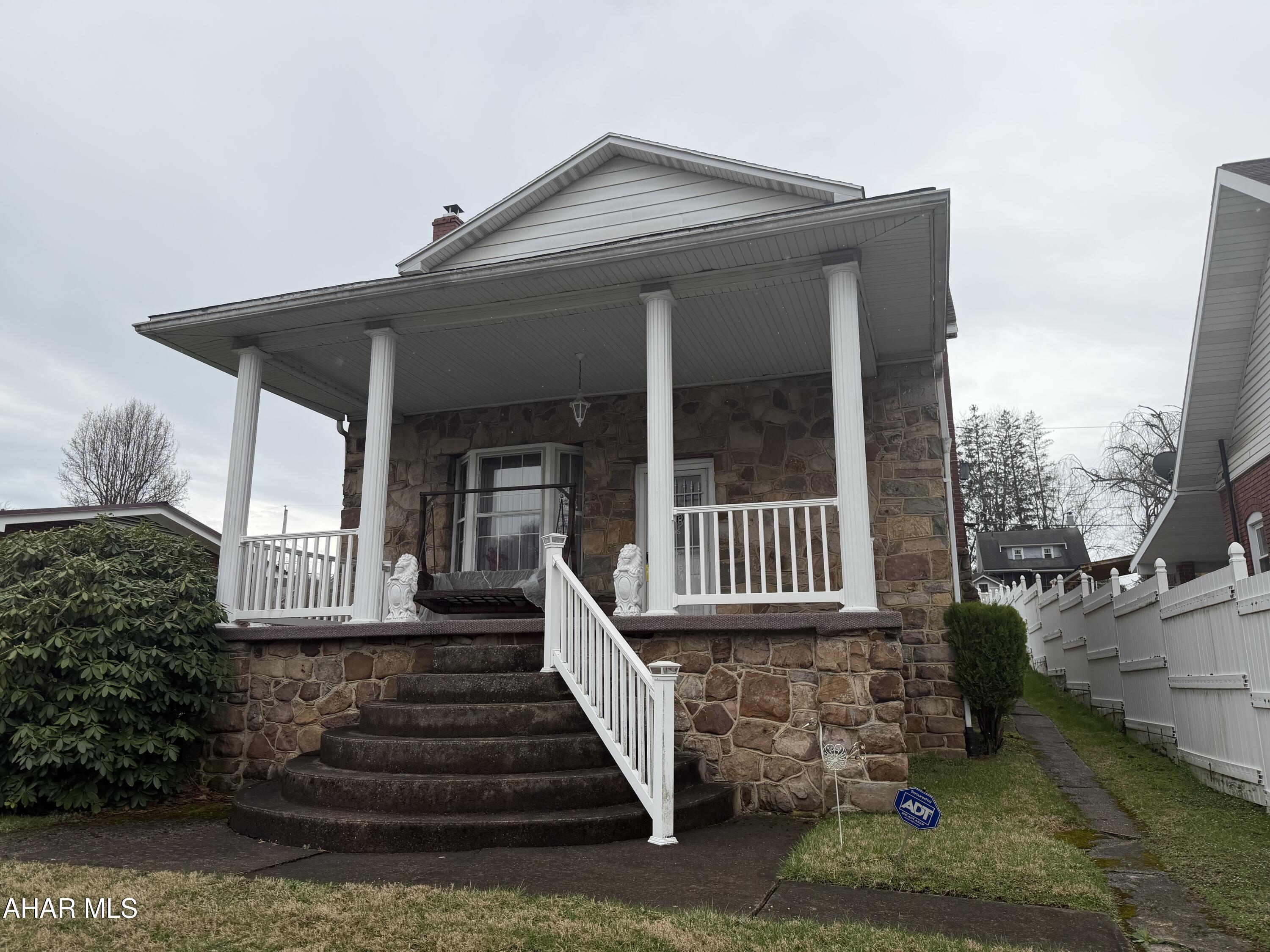 Cozy 2 story stone home with a nice sized yard in Tyrone Borough. This spacious 2 bedroom home features lots of living space. Living room with fireplace, dining room, and large kitchen with breakfast bar. Partially finished basement has room for entertaining. One car garage with 2 car carport. Driveway with an extra carport.