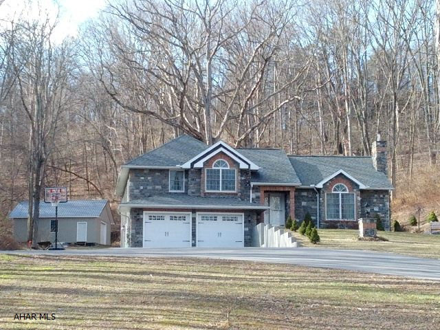 Beautiful 4 level split home, vinyl siding, bright home with custom made cabinets, granite counters, ceramic tile floors, hardwood flooring and carpet. Bedrooms have walk-in closets. 2 car garage plus 2 car detached heated garage.   J-180