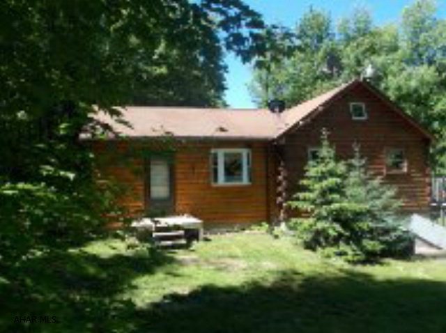 Hastings: 514 Spruce Road Extension. A nice log cabin with addition on almost 2 totally secluded acres in the country. Wildlife galore. Country kitchen with appliances. 3 bedrooms. Has an additional loft for a game room. Half finished basement with pool table and wood burner included. Oil HA heat. Shed and dog kennel.