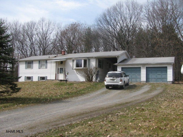Bellwood schools--Antis Twp bi-level home on almost 4 acres of partially wooded ground! EIK., DR., LR., 3 Br., and 2 baths, 2 car detached 22x25 garage, screened deck, wood burning fireplace in partially finished family room! Priced to sell @ $149900