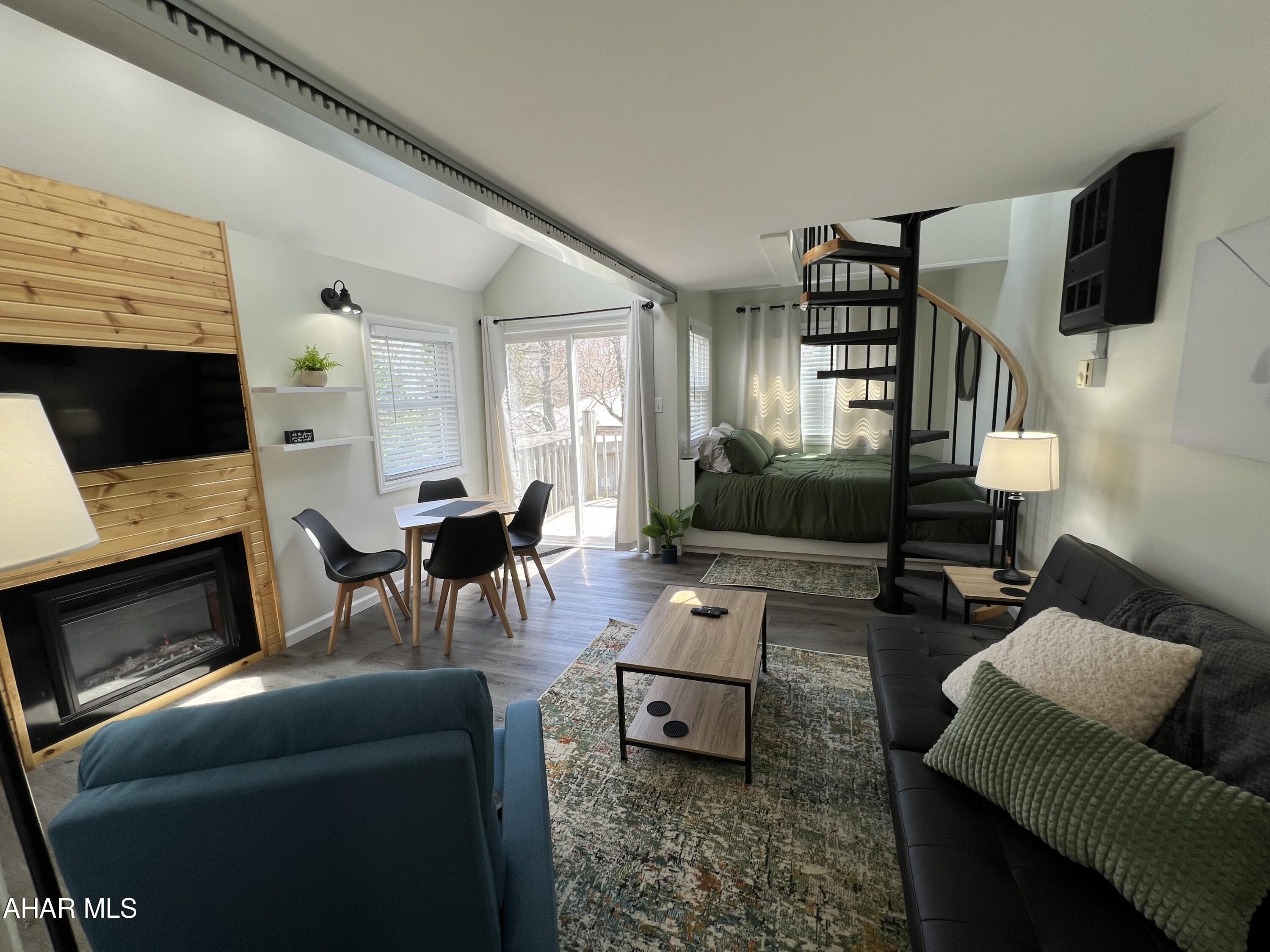 Beautifully renovated loft in the Allegheny Mountains at Blue Knob All Seasons Resort has everything you need. Remodeled and fully furnished. New kitchen cabinets countertops, windows, sliding door, flooring, fireplace, stainless appliances and so much more. Breathtaking stone fireplace and Wood accents make this condo a wonderful place to be anytime of the year. Walking distance to indoor pool/hot tub, outdoor pool and The Club House Bar & Grille. Blue Knob is the 2nd highest mountain and highest skiable mountain in Pennsylvania! In addition to an array of winter activities, Blue Knob also has a full-service all seasons Conference Center for weddings and events, they also offer golf, swimming and multitude of trails for hiking, running, and mountain biking. Visit https://blueknob.com/activities-events/ to see all the fun events that are happening at Blue Knob. $290.00/ Mo HOA fee includes: pools, hot tub and gym area, tennis and pickle ball courts, building, property maintenance & garbage. *Additional fees apply for conference center, Golf and Skiing