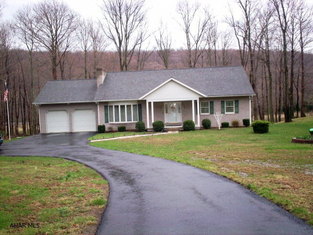 This exquisite 3 bedroom/2 bath home on 2.6 acres was built in 1994 by Bill Waltman. It is in immaculate condition in a beautiful and quiet setting along Cumberland Road (just minutes from downtown Bedford). The family room has a large gas fireplace which is perfect for those cold winter nights. The main floor is entirely carpeted throughout(excluding the kitchen) and is quite spacious. There is an in-house vacuum system for easy vacuuming throughout.  A stream borders this property to the left of the paved driveway. This is a beautiful home and a perfect setting for raising a family. If you appreciate quality craftmanship, you have to see what is located in the basement of this home.  It is one of a kind!! (Can be purchased seperately.)