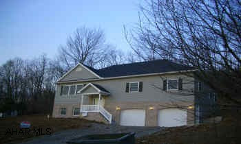 Unique split entry with 9ft ceilings, all one floor living including 1st floor laundry and large pantry, all tile baths and kitchen, large master suite with garden jacuzzi and sep shower, finished room for family room, office or 4th bedroom with 3/4 bath in daylight basement. Lots of storage space and oversized, insulated and finished 2-car garage. Large lot with privacy. Agent Owned.