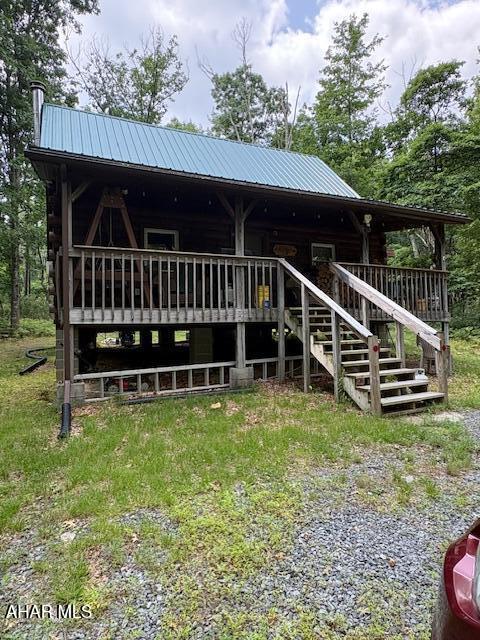 Escape to your own private 7.4 acre wooded sanctuary. This secluded off-grid log cabin offers an open concept 1st floor with kitchen, and ding area. Living room has vaulted ceiling, with wood burning stove.
1st floor bedroom, spacious sleeping loft upstairs. An 8X16 screened porch would be great place to enjoy your meals, bug free.
Covered front porch is best place to view wildlife walking through property. New metal roof in 2023 , garage for your storage needs, as well as an outhouse. Backs to State Gam Lands. Snow Shoe Rails to Trails & Bloody Skillet for your ATV/UTV riding right from property. Close to Historic Bellefonte, Penn State and Bald Eagle state Park