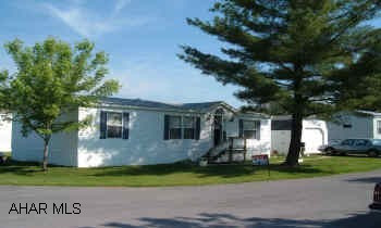 2003 mobile home on rented corner lot with shed and garage Larger than it looks. Vaulted ceilings, central air, 2 spots for off street parking, garage with electric