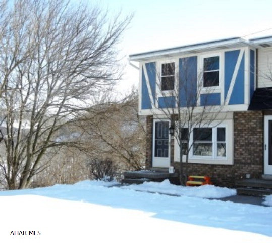 This END UNIT OF END BUILDING has a wrap-around deck (off the kitchen),patio (off the family room),a fenced in yard, and a view. So many updates too: Kitchen has new laminant tile floor, cabinates, countertops and appliances. Living room has new laminant wood floor. Basement family room has new carpet, bar, fireplace and pool table. Water heater 2009. New windows 2013. Roof 1997. Just move in!