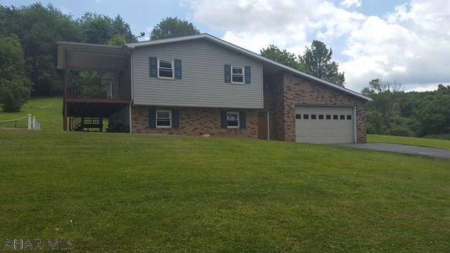 DON'T MISS THIS BEAUTIFUL SPLIT LEVEL HOME ON .82 ACRES . THIS HOME HAS A GREAT FEEL , THE CUSTOM HICKORY KITCHEN CABINET AND CUSTOM HICKORY FLOORS IN DINING AND LIVING ROOM. ARE THE PERFECT ACCENTS TO THE STONE FIREPLACE. A LARGE  4 SEASONS ROOM OVER LOOKS A  BEAUTIFUL BACKYARD .  ALL BEDROOMS ARE ON ARE ON THE LOWER LEVEL OF THE HOUSE, LARGE MASTER WITH ITS OWN PRIVATE BATHROOM.   THE SPACIOUS LAUNDRY ROOM IS RIGHT OFF OF THE BEDROOMS MAKING  THIS HOME VERY LIVING FRIENDLY...GARAGE IS AN OVER SIZED 2 CAR WITH A WORK SHOP AREA...THIS HOUSE IS SURROUNDED BY PEACE  AND BEAUTY... DON'T MISS THIS WONDERFUL HOME !!!!