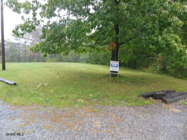 Nice level 1.5 acres of ground in Pleasant Valley, just inside of Logan Twsp. No utilities, but are near by about 130 feet away in George Avenue. A great site for a home with respectable neighhboring homes. 75% clear bordering woodsy area. Construction loan or cash.