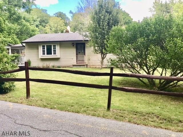 Well Maintained 2 Bedroom Ranch located in Quiet Wooded neighborhood. This home is situated on a corner lot facing woods with hiking trails. This home features new Kitchen Cabinets and Countertops.  Would make a great Starter home or an Empty Nesters Dream. Enjoy your coffee on the covered deck right off of the kitchen.