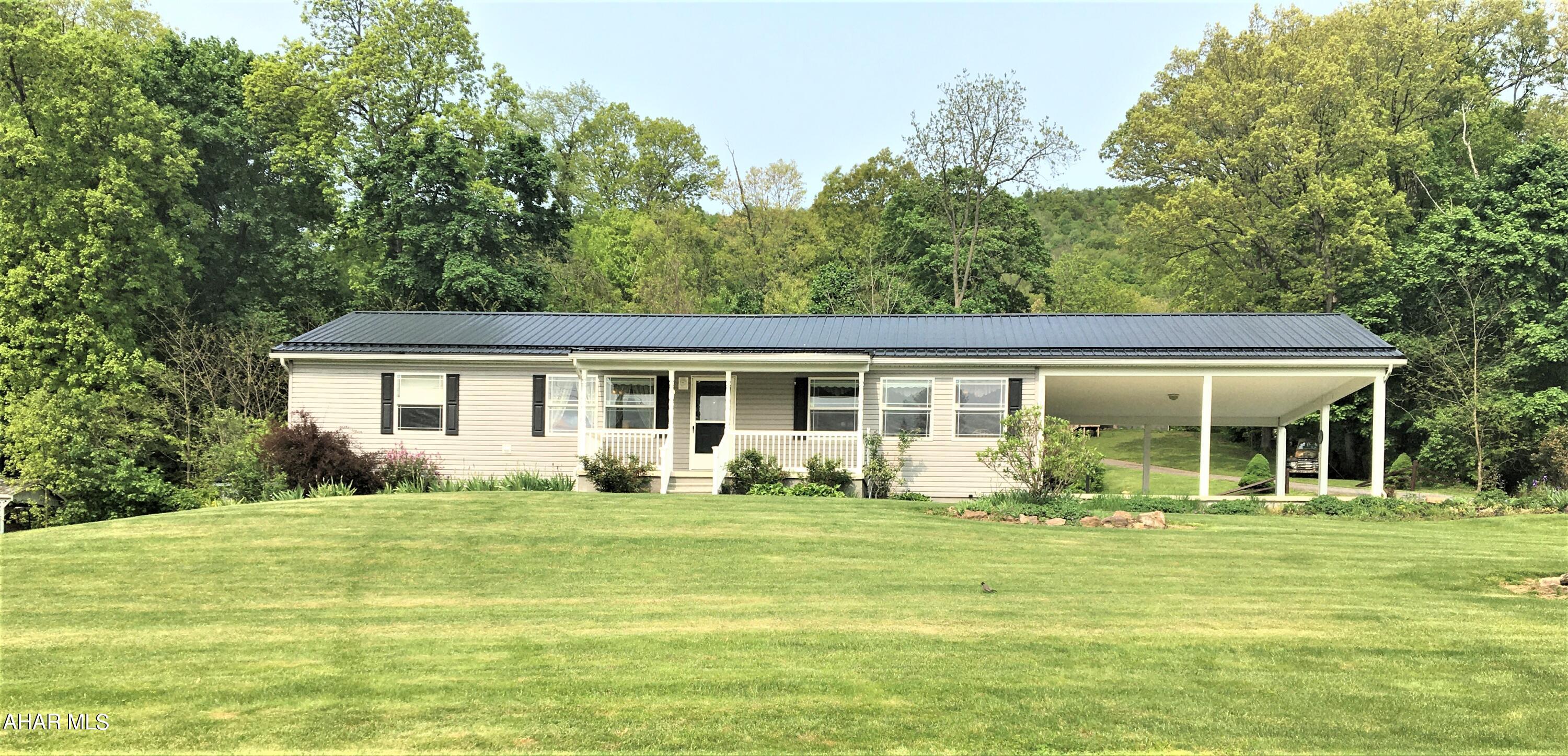 Life will be great in this easy care Ranch Home. One level living space ,with a full basement with a high ceiling just waiting to be finished, canning kitchen area in basement and a 3/4 bath. Wood Stove located in basement as well for warm, cozy heat. Other heat source is Oil F/A as well as Central Air, garage door opens to drive the wood right in to the stove. Come in from the spacious main level carport to a mudroom/laundry room, washer and dryer are included. Open concept dining area / kitchen with all new black appliances, lots of cupboard space , a center island. Living room leads out to a covered front porch for lazy evenings (owner says you can hear the Everett Football games on Friday evenings). 3 Bedrooms and 2 full baths. Primary bedroom has one of the baths with 2 sinks , separate shower and garden tub. Walk-in closets in all 3 bedrooms. Outside has a nice shed for extra storage, easy care landscaping. Don't miss this lovely home!