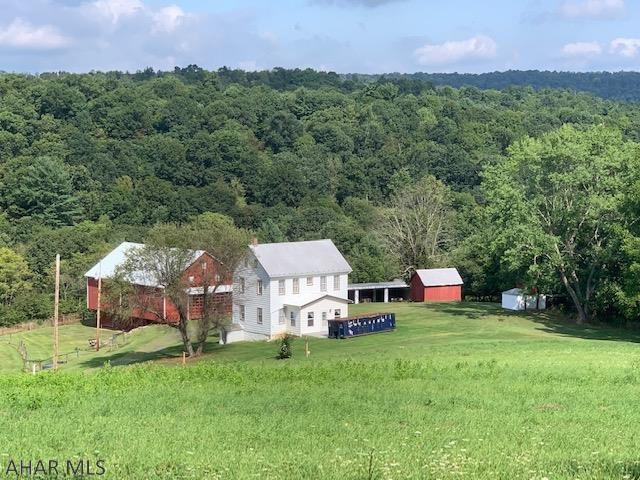 Getting away from the hustle and bustle....living the good life....that is what you will find here on this country homestead. This property has been immaculately well kept, the country farmhouse and outbuildings are the perfect example of the way we used to live....Partially wooded and partially fields, the contour of this land has an easy flowing feel. Not steep, just gently rolling. The three ponds on this property are just absolutely relaxing, complete with a pavilion and picnic area. Country vista with 360 degree views. Don't want to miss this once in a lifetime opportunity...