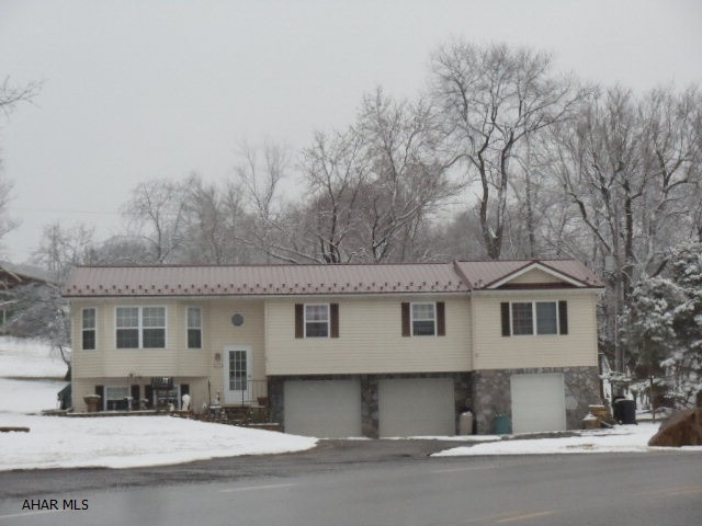 5 bedrooms, 2 and 1/4 baths. 2.5 car garage. Screened porch. J-117.