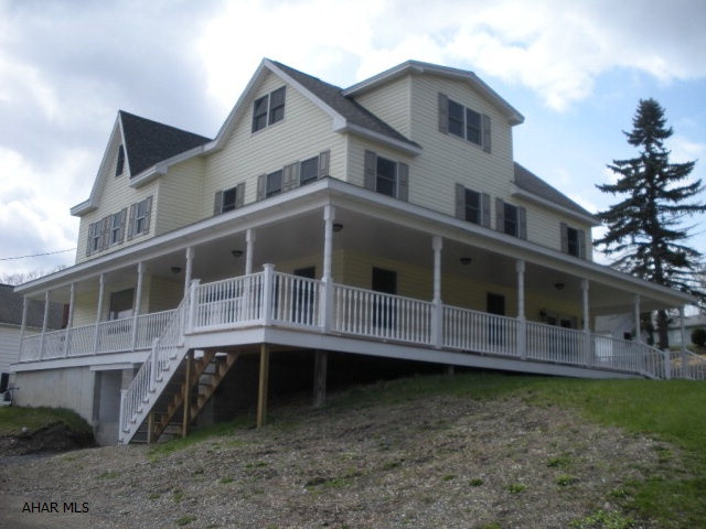 Recently renovated 5 bedroom 4.5 bath home in North Altoona, this large home sits on a corner lot, the wrap around covered porch is a great place to welcome guests.  Stepping inside you will find new flooring throughout, brand new hickory kitchen with granite counters, stainless appliances, breakfast bar and under cabinet lighting.  There is a first floor laundry and bath.  The dining area is open to the living area and kitchen.  The master suite has a large full bath with soaking tub and separate shower.  The 3rd floor has 2 bedrooms, one with a private bath.  This home has central A/C and a large unfinished basement that has 1/2 bath and a walkout to a covered porch.