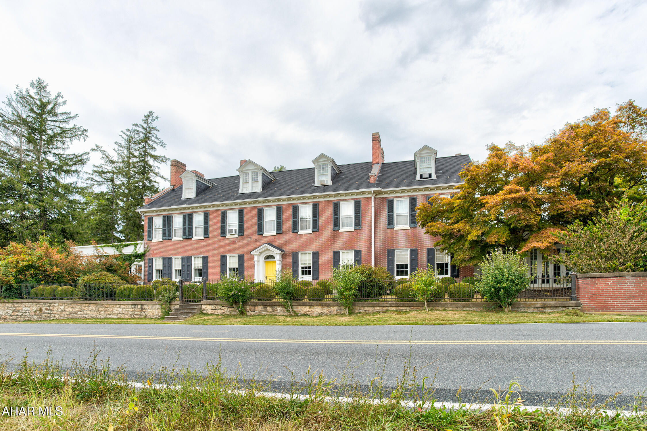 Welcome to one of the most spectacular event venues in the northeast!  This complete turnkey business is part of a thirteen acre estate nestled in the scenic Juniata Valley.  Less than an hour from either Harrisburg, or Penn State University in State College, this beautiful property includes two historic homes on separately deeded parcels, complete with furnishings, event venue equipment, multiple indoor and outdoor settings for events and activities, all set within a serene, stunning setting. 
The Manor is a well maintained stately brick home, rich in history and with a number of exceptional details, from the trim and woodwork, the grand ceilings, beautiful fireplaces, ceramic tile accents, attractive light fixtures, and much more.  The main floor reception hall is exceptionally light and cheerful and useful for so many types of events.  It spills into multiple rooms offering social spaces and display rooms.  A traditional and commercial kitchen provide ability to cater nearly any need. The second floor and third floors contain seven bedrooms, with a second floor owner suite that is exceptional with an owner bath, and separate reception/family room.  Walk out onto the rear patio which stretches out from the reception hall, and view a beautiful landscape and several attractive outbuildings. 'The Coup' provides two additional bedrooms and bathrooms for guests. Pair this with the home and grounds of The Wilson House and you have a complete operating wedding venue business that offers many more opportunities--only limited by the imagination. Contact for more details as there are too many to provide here!