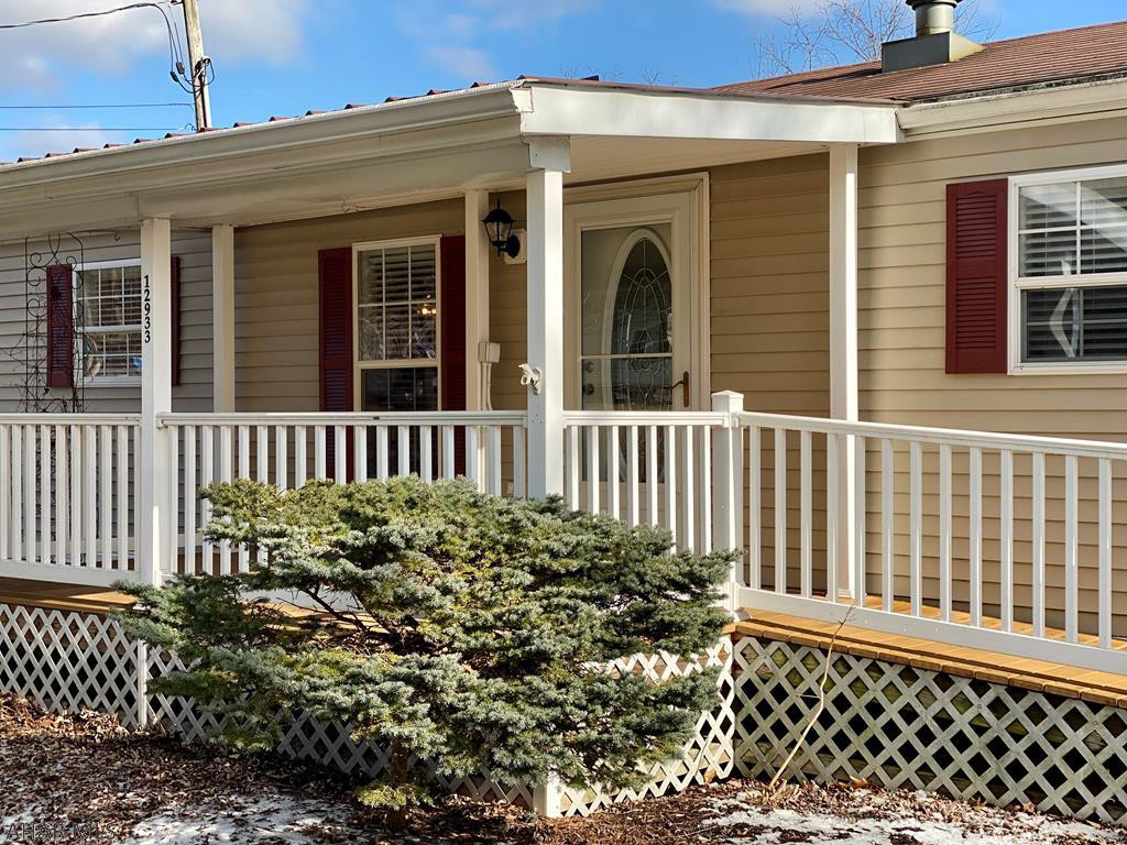 Here is your opportunity to enjoy affordable lake life, whether for a vacation getaway or year round home.   Beautiful 3 BR, 2 BA, meticulously maintained single wide with upgraded package, brand new kitchen and bathroom counter tops, situated on a 1 acre rented lot, with ample parking for a boat and includes a storage shed to store all your toys.  Just minutes from the Raystown Lake Seven Points Recreation area.  Owner Suite includes large 3/4 bath with two walk-in closets.  Open concept living, dining, kitchen for entertaining and relaxing after a day at the lake and central air to cool off.  Enjoy your morning coffee on the covered front trex deck, which also features a ramp.  Call today, and you can be settled in before spring.