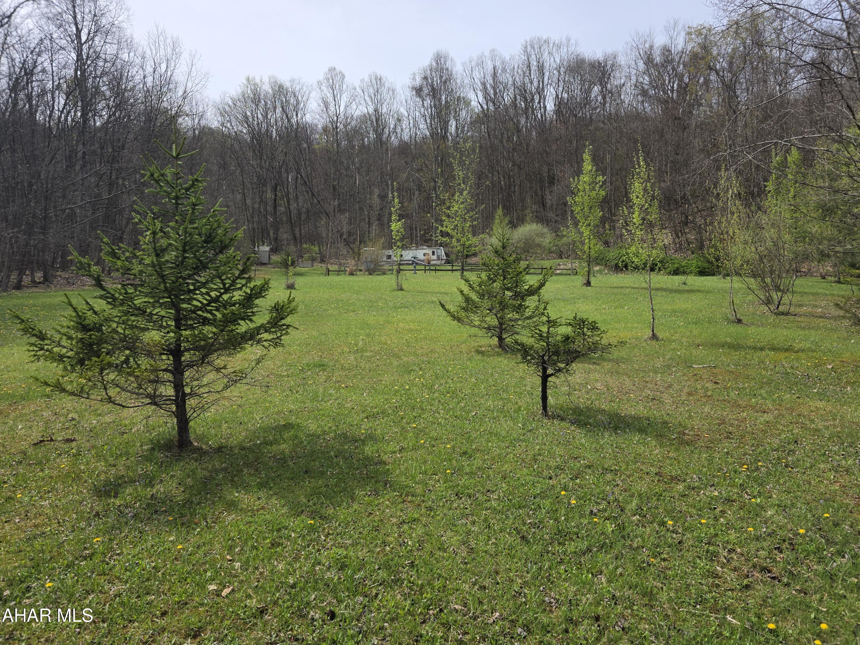 3.41 acres for sale in Clearfield County. This lot has approximately 1 acre cleared with beautiful views of the surrounding area. There is a driveway leading in that loops past the gas well. The owner is selling the gas lease with this property; they receive approximately $100 per year from royalties and free natural gas use on the property. There was also a perc test done in 2011, see the approval letter in the attached documents. There are also several natural springs located on the property as well. No close neighbors, as it is surrounded by woods. It is located within 10 miles from the Rock Run ATV/Recreational Park. It has fantastic hunting and fishing in the area as well. There is a camper that is included with the sale of the property. This is a nice quiet and secluded property, that would be great for a home or camp!