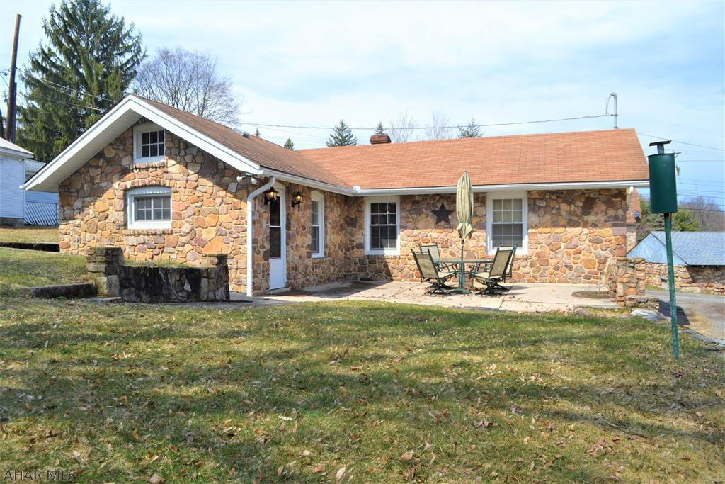 SO MUCH old world charm that you just do not see today!   This stone single story home is adorable and sure to be an ideal match for someone.   With a large eat-in kitchen, 2 bedrooms, a garage, and quaint surroundings, you cannot go wrong.  Plenty of yard (131' x 121' irr) to enjoy & off-street parking.  New soffit and fascia just added, along with all windows being capped.   If living outside of town (but still convenient to things) is your wish, then you will want to check this one out!  **OPEN HOUSE THIS SUNDAY, MAY 6th FROM 12:30-2:00pm.**