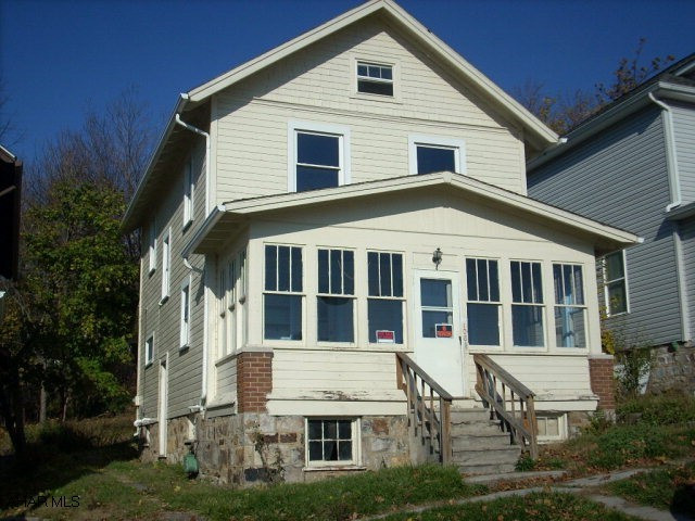 2 1/2 Story Frame Home, 3rd floor is heated.  Great investment opportunity.  Enclosed front porch, plenty of storage.