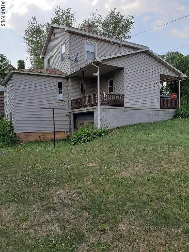 Single family home on corner lot walk-able to town. Large rooms with high ceilings ans a very spacious eat in kitchen. 2 large bedrooms upstairs with a full bath. Ample storage throughout. Basement walks out to additional parking and back yard. 1 car integral garage with more storage options. Needs some TLC,but call today to make this one your own!