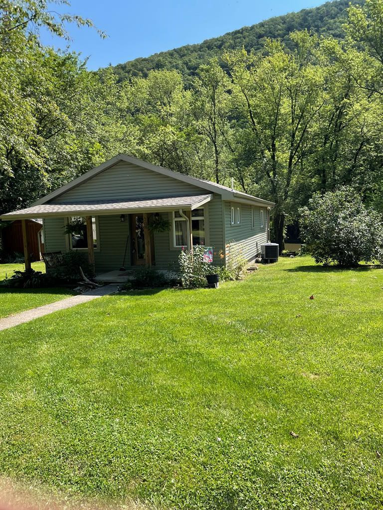 Sweet little cottage on the river, redone, has a cute little she-shed, newer detached 1 car detached garage. 2 bedroom , 2 bath . Heat pump with central air. Propane fireplace in living room. Perfect place to sit back relax and enjoy the things the river has to offer.