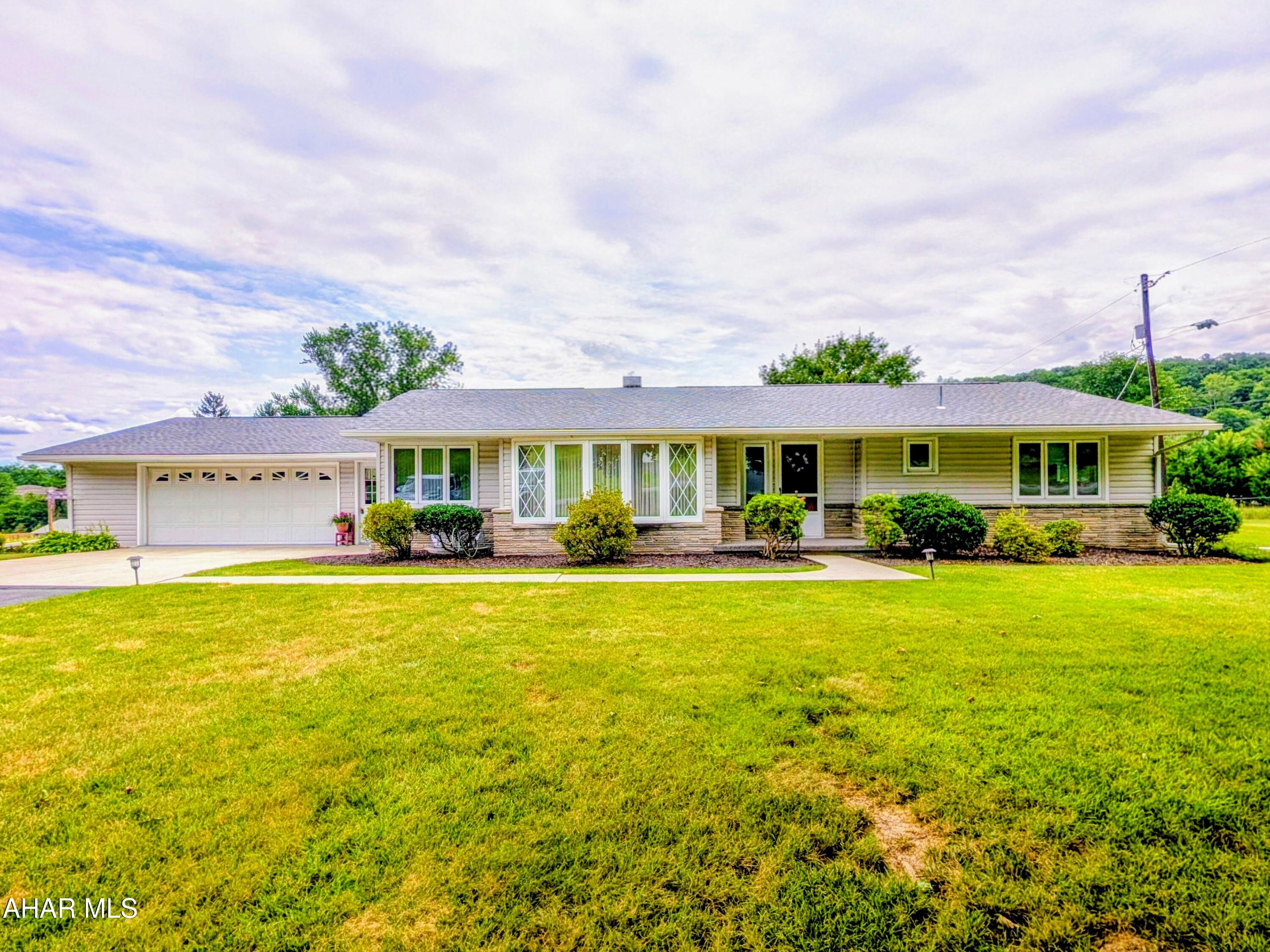 Are you looking for a move in ready Ranch home, then please come check out this one. Roof is less than 2 years old, has vinyl siding with stone accent. Windows all insulated through-out. The yard has been immacultely kept and is level, with tasteful landscaping . Two car attached garage leads into the main level laundy room . Nice kitchen with lots of cupboard space and an eating area, all appliances are included and dishwasher is brand new.  Nice size living room with beautiful bay window.  Three nice size bedrooms and two bathrooms. An all season room in the back is light and airy and exactly where you can imagine yourself spending  lots of time, all furniture is included in that room. Heat is multiple sources. Ceiling radiant or electric baseboard with thermostats in each room. Kodiak insert woodstove in the basement family room area for wood use. 5 brand new mini-splits installed last week for cooling and heat use! Plenty of storage space  for all your extras. Call today to set up your appointment to see for yourself